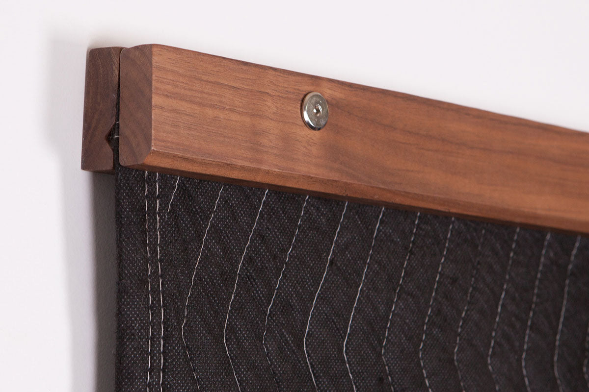A wooden quilt hanger won't damage your textile