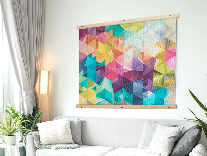 Colorful geometric art piece displayed in a magnetic hanger frame.