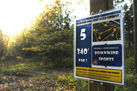 Hole 5 of the Powdermill disc golf course in Marquette sponsored by Down Wind Sports