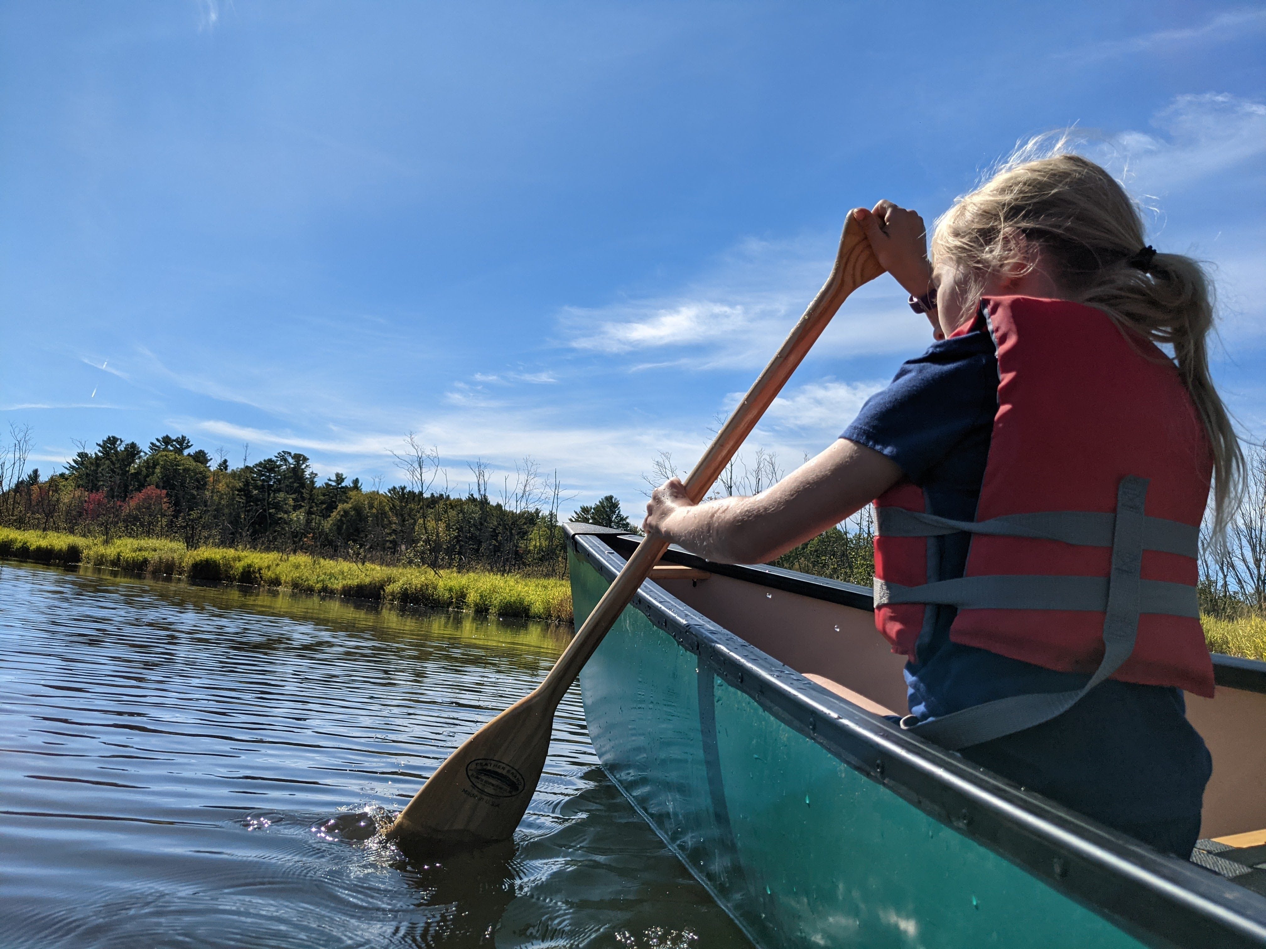 young girl canoeing