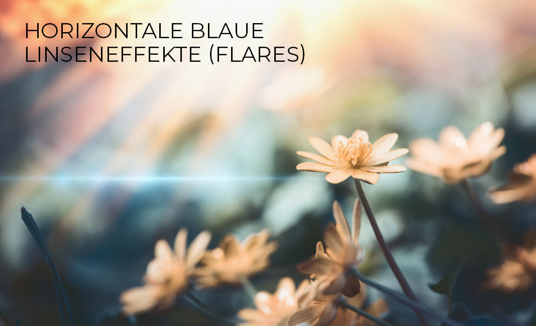 Horizontale blaue Linseneffekte (Flares)