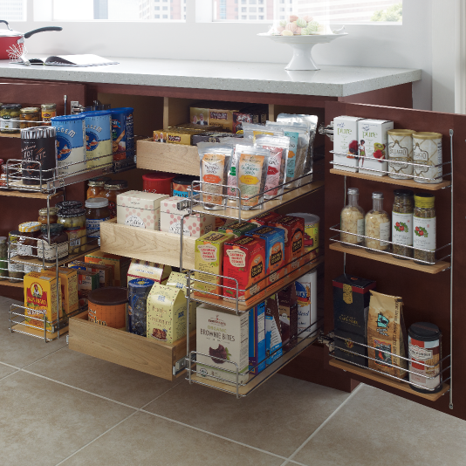 End base super cabinet with three pullout drawers and three shelves on the door filled with pantry grocery items