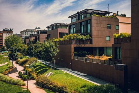 Modern residential buildings in the public green area. Real estate houses in Milan, Italy.