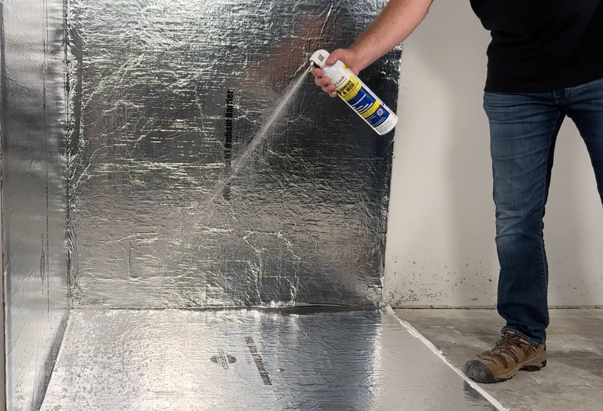 Spraying SCIF Room floors with Spray-Lock spray adhesive