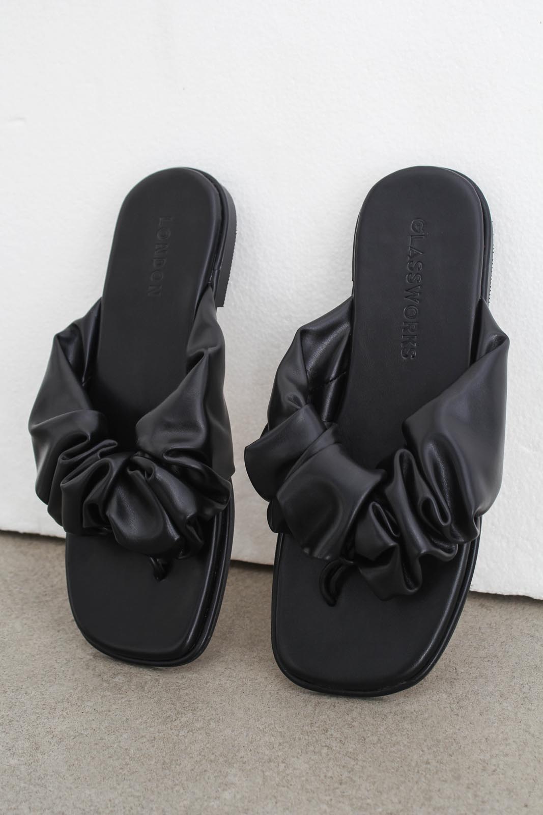 Black puffed vegan leather sliders