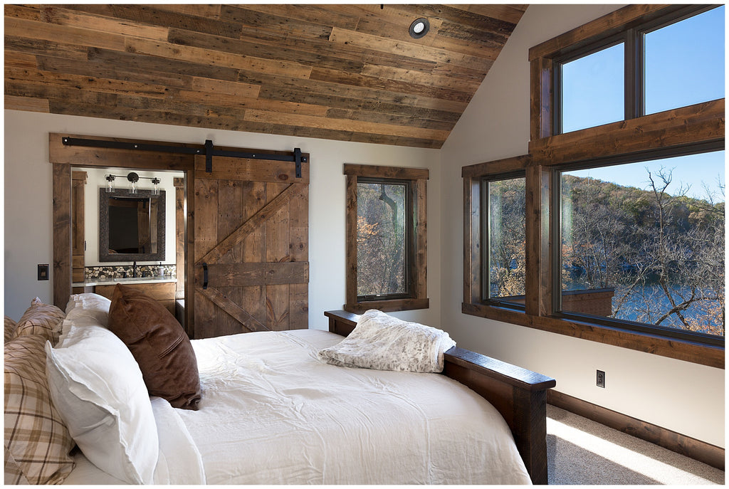 reclaimed wood ceiling in bedroom - barn door bathroom - detroit lakes mn lake home - dakota timber co.