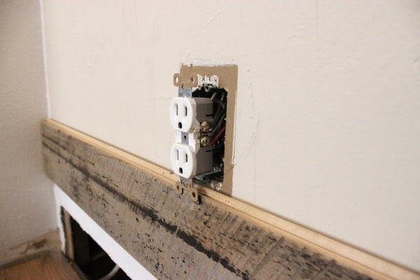 Reclaimed Wall Paneling Around Wall Outlet