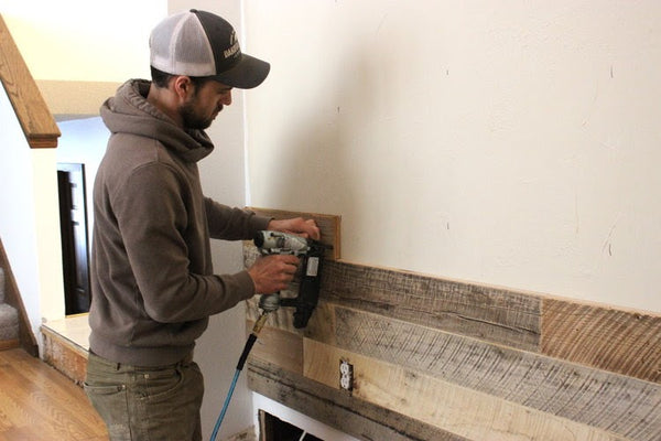 Man Installing Reclaimed Wood Tongue & Groove Wall Planks