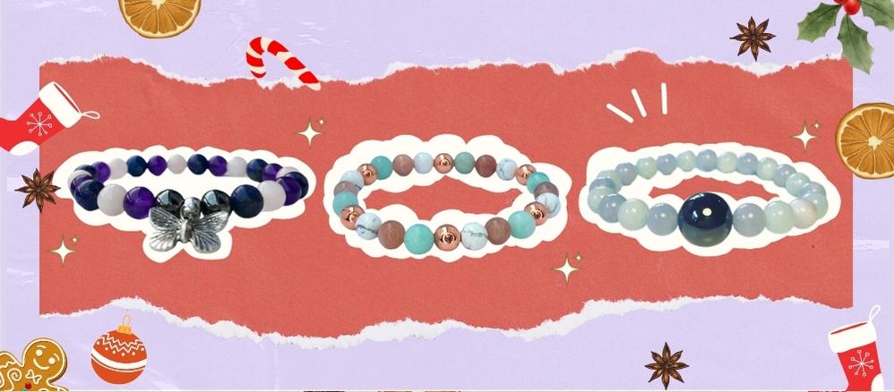 three Crystal Bracelets on red paper and lilac background with Christmas cartoon graphics