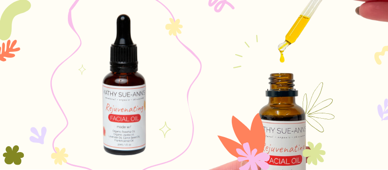 Kathy Sue Ann's Organic Rejuvenating Facial Oil on off white background with cartoon graphics
