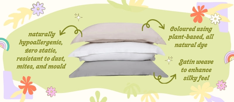 three Eucalyptus Silk Pillowcase stack together on a green blob with cartoon graphics around