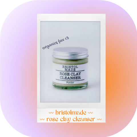 Polaroid image of natural clay cleanser on a gradient background of lilac and orange