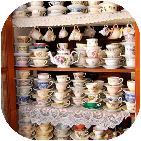 vintage tea cups in mid century cupboard