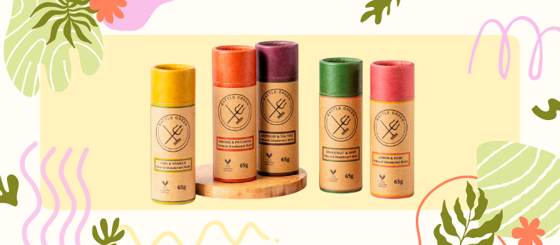 five natural deodorants on pale yellow and off white background with cartoon graphics