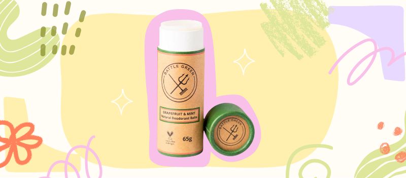 Grapefruit & Mint Natural Deodorant Tube on a yellow blob with cartoon graphics