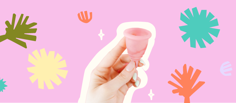 Menstrual cups on pink background with cartoon graphics