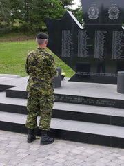 Soldier standing in front of the Afghanistan memorial at Canadian Forces Base Petawawa, Ontario, Canada