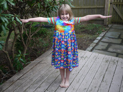 Dorybird: Girl in Handmade Rainbow Crossover Dress