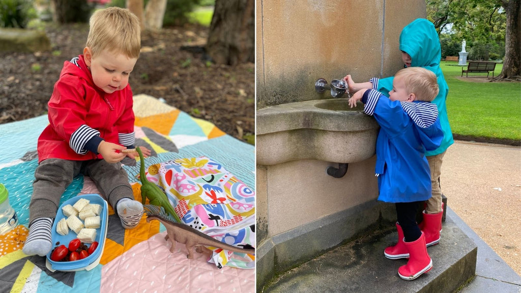 Toddler boy wearing raincoats and rain boots