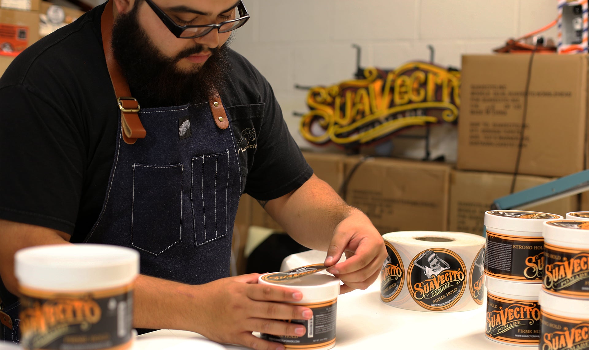 Worker Wearing Suavecito Work Apron in Denim