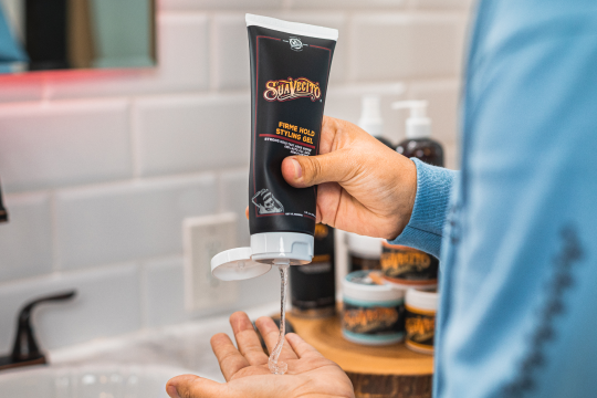 Suavecito Firme Hold Styling Gel dispensing into hand