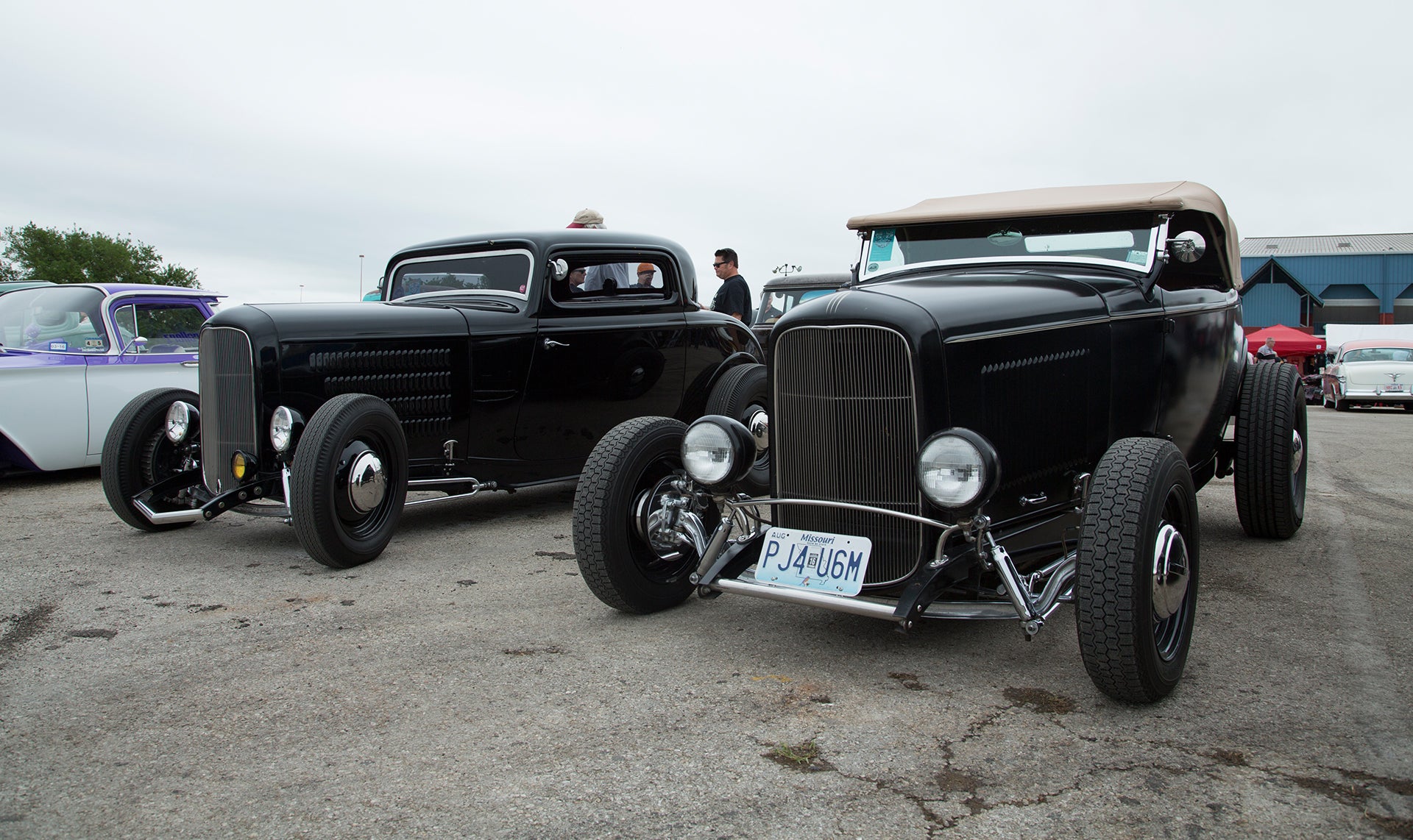 Two black coupes side to side