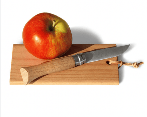 apple on a tiny cutting board