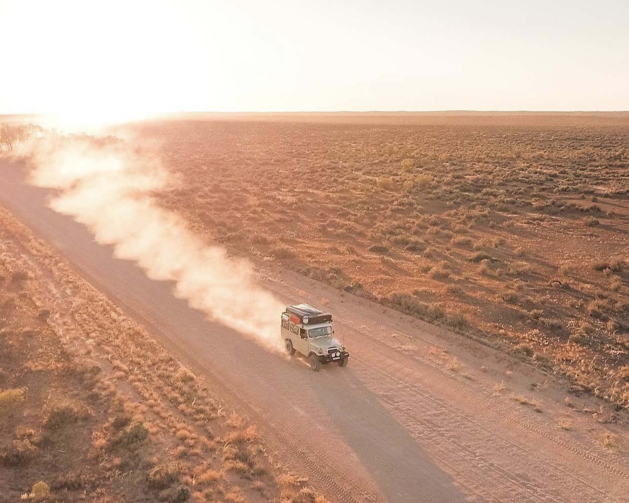 Road trip along dusty outback road