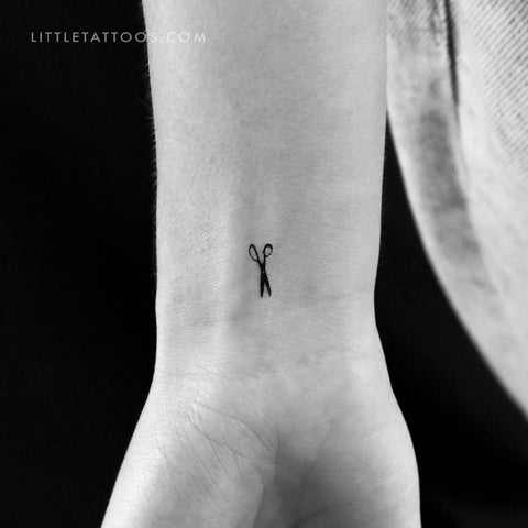 Scissors tattoo on the rib - Tattoogrid.net