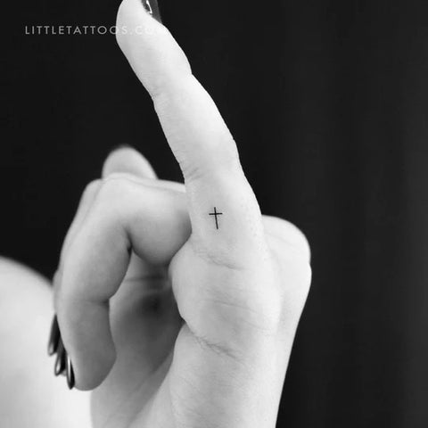 Faith tattoos: Fine line tiny cross tattoo