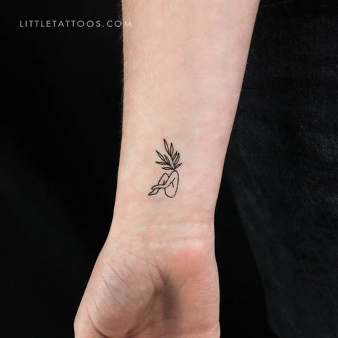 Female figure tattoos: Leaf head woman tattoo
