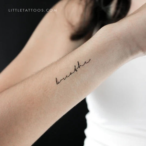 Mantra tattoos: breathe handwriting tattoo