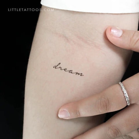 Mantra tattoos: Dream handwriting font tattoo