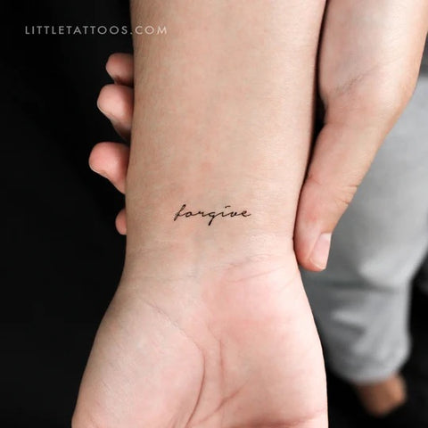 Mantra tattoos: forgive lettering tattoo