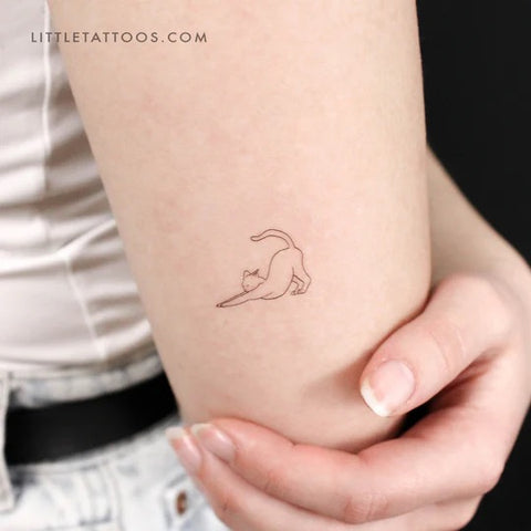 Nature tattoos: Stretching cat fine line tattoo