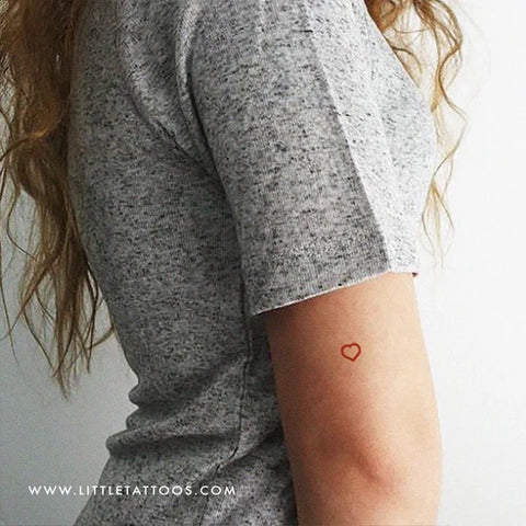 Red Tattoos: Red ink heart outline tattoo
