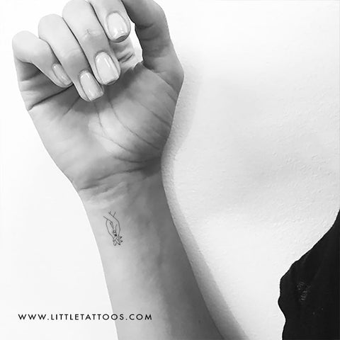healing hand symbol tattoo
