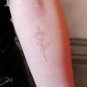 Fine line rose tattoo in red ink