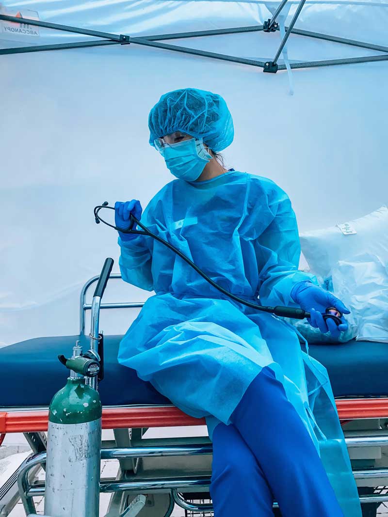 Nurse in PPE displaying 3M Littman CORE Digital Stethoscope