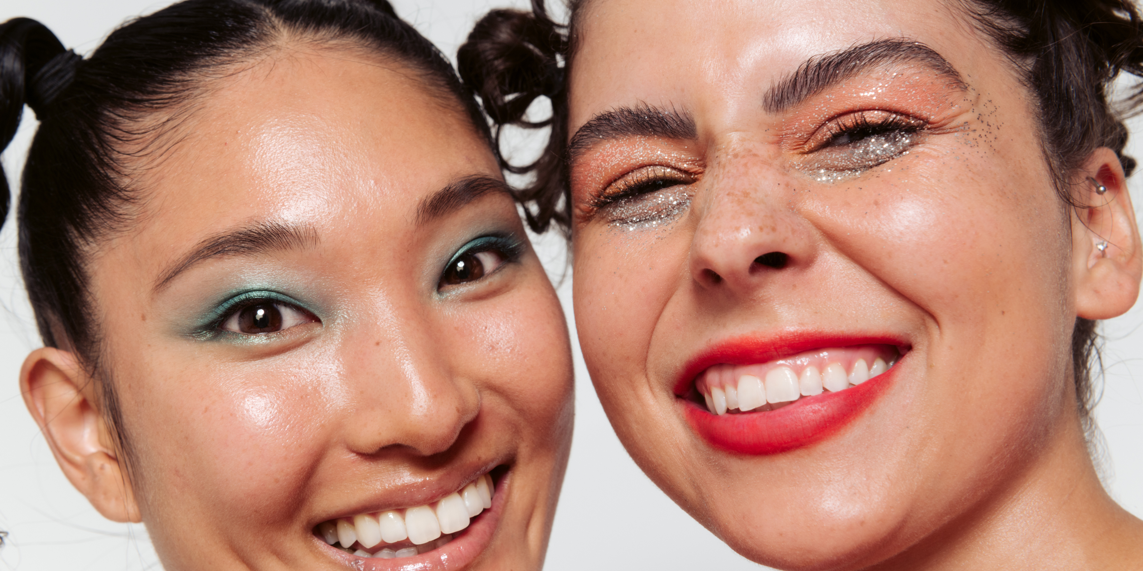 two girls smiling, red lipstick, blue eyeshadow, glitter, tbh skincare, acne hack spot treatment 