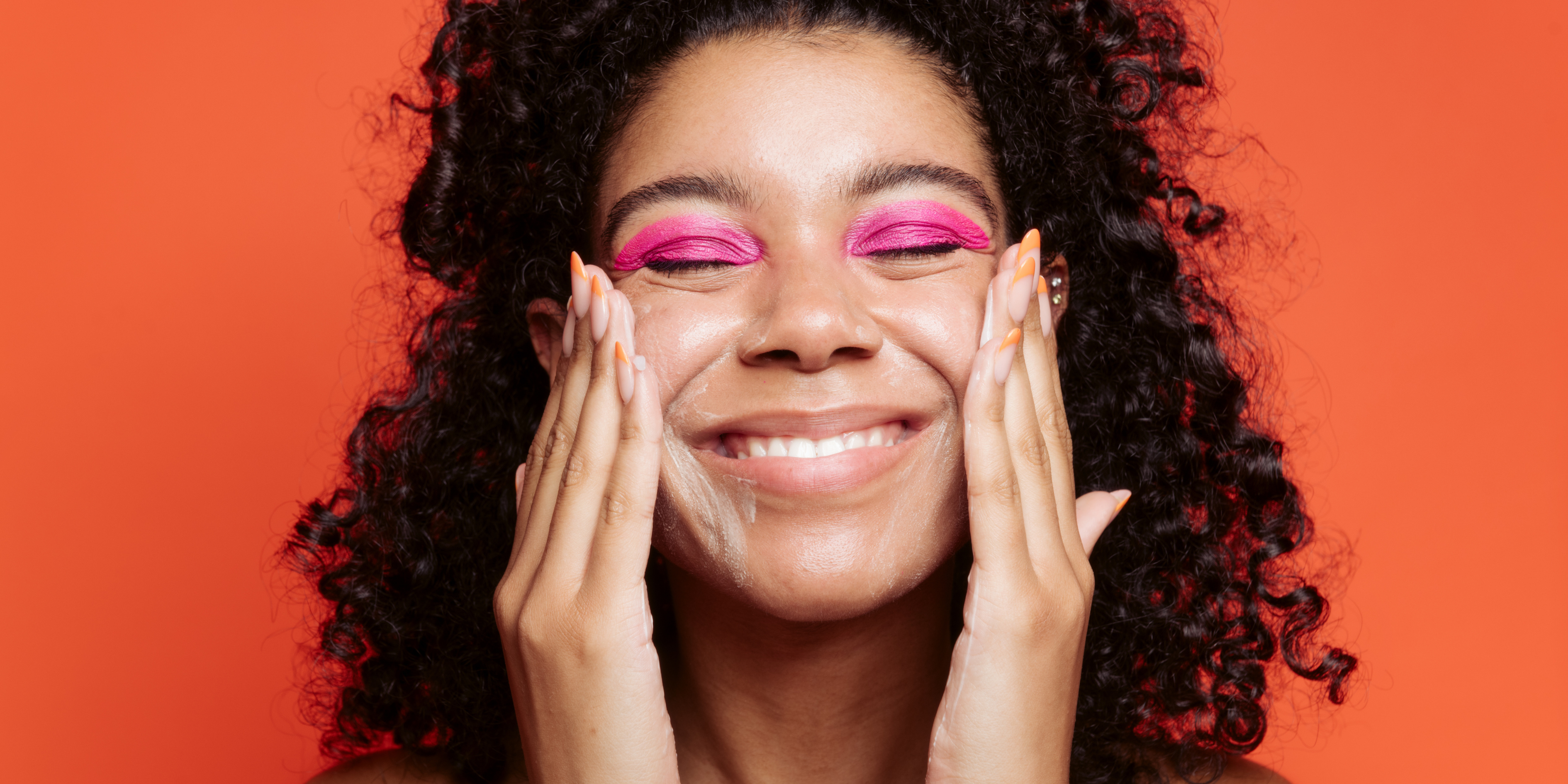 girl washing face, pink eyeshadow, orange background, damaged skin barrier, rebound serum 