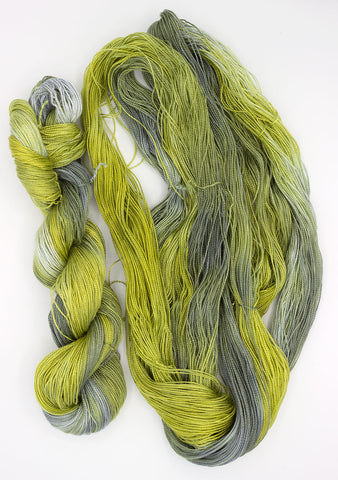 Liam paints 5/2 Tencel yarn - green-grey skeins