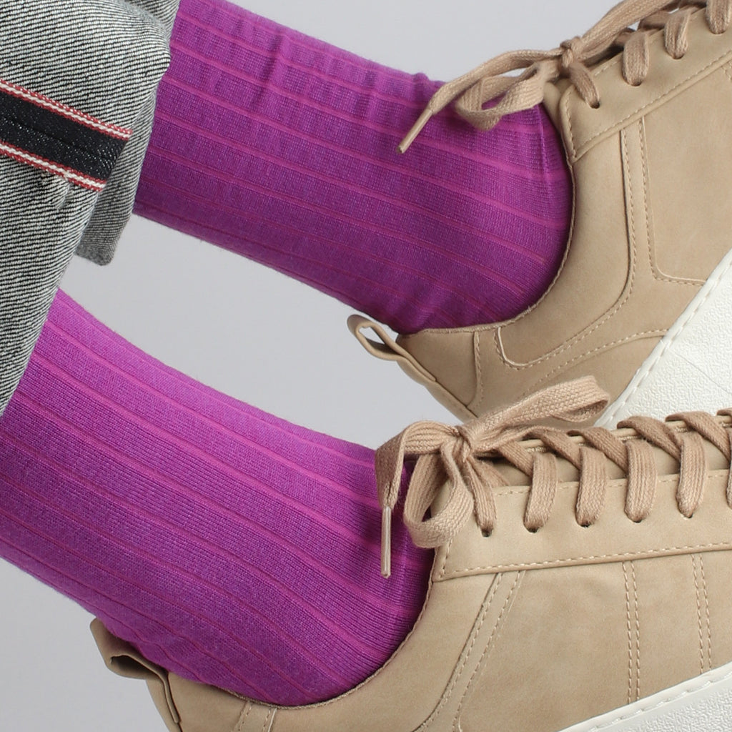 man wearing grape coloured wool socks