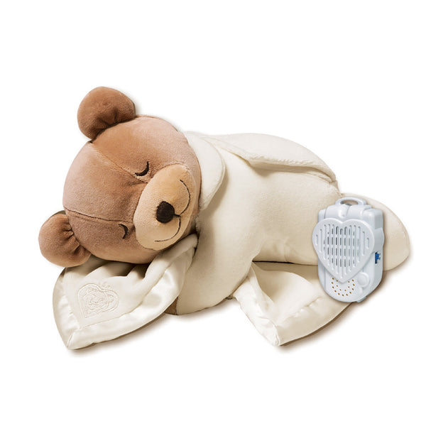  a stuffed bear wrapped in a neutral blanket