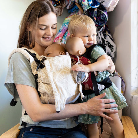 You can practice babywearing with a doll or teddy before you try with your baby