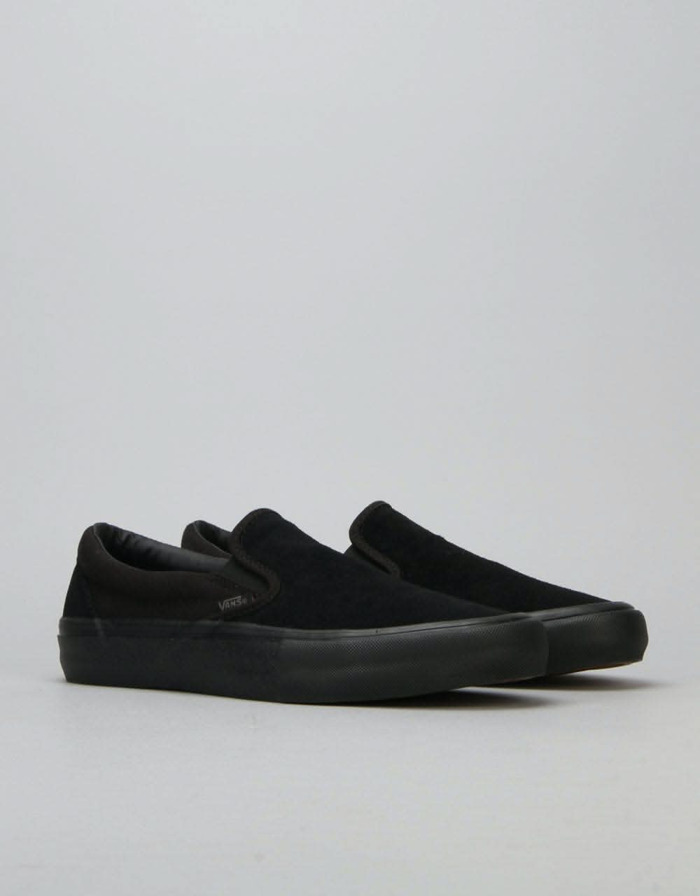 vans slip on black mono