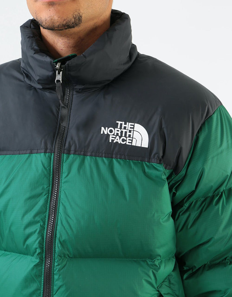 dark green north face puffer jacket