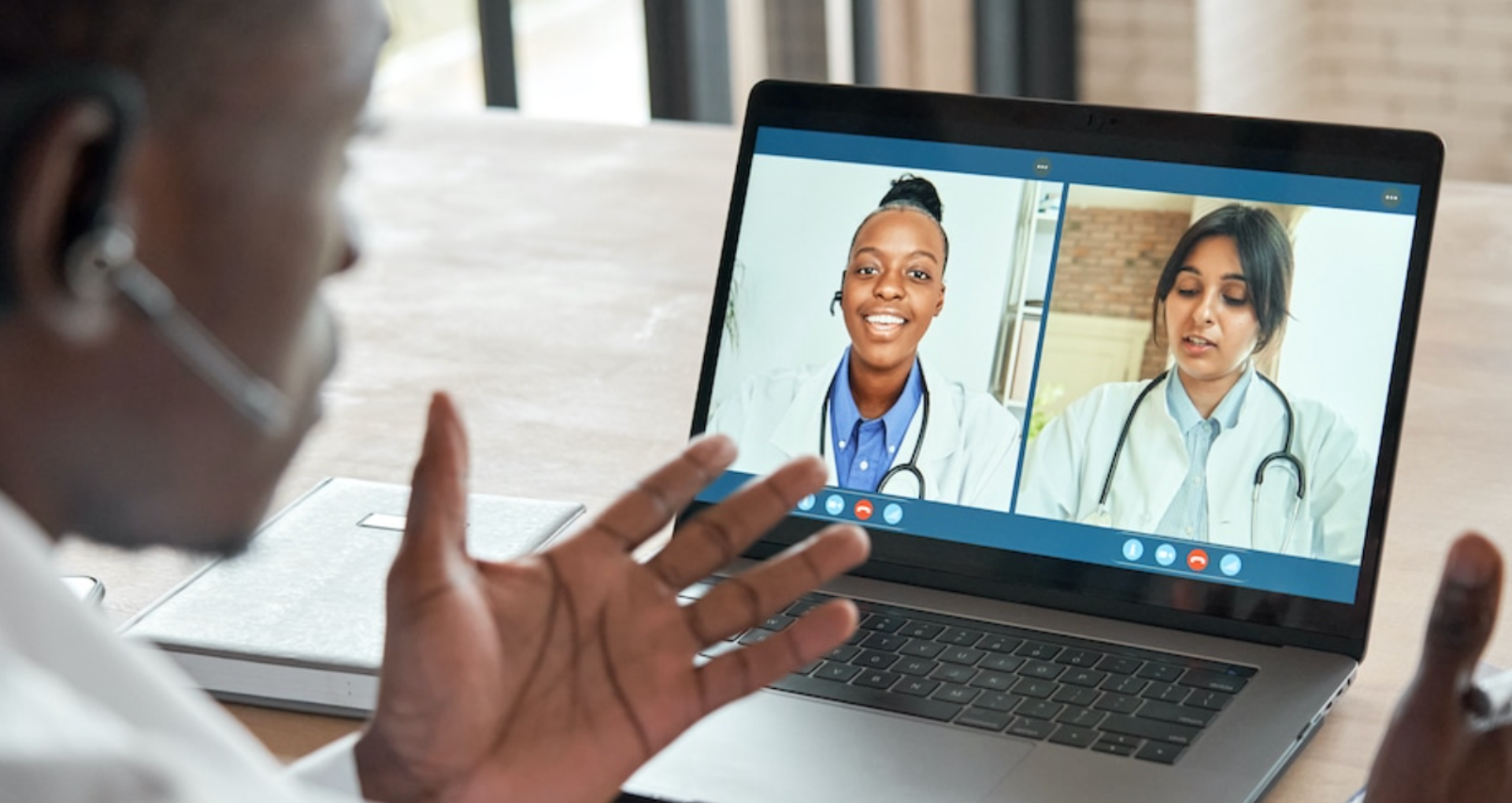 Doctors discussing patient care over video meeting