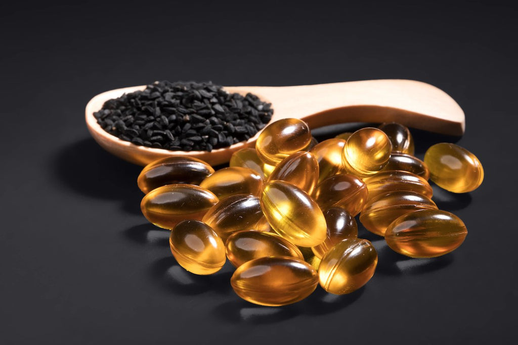 Black seed oil capsules and black seeds from Nigella sativa