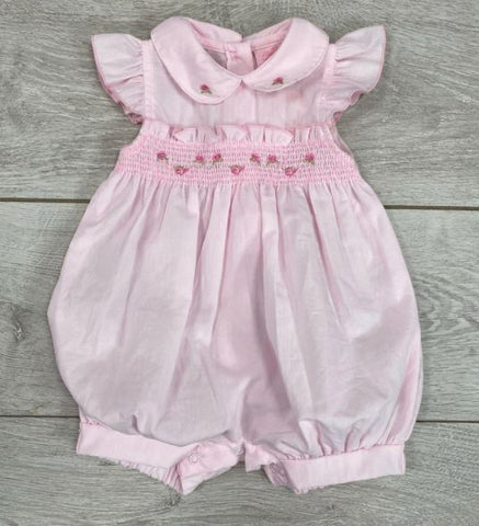 This beautiful pink romper suit is a perfect pick for this summer! Featuring a lovely band of embroidered flowers on the waist, a pretty floral collar and lovely genie style bottoms, this romper dress will make a beautiful baby summer outfit.